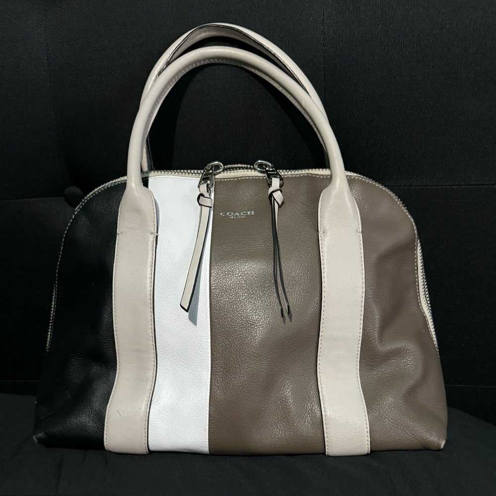 Coach handbag Never used. Tan, black, white & brown. Excellent condition